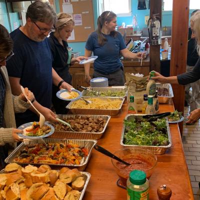 Members of our Cabaret cast, crew, and staff preparing their dinners