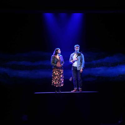 A production photo of the cast on stage