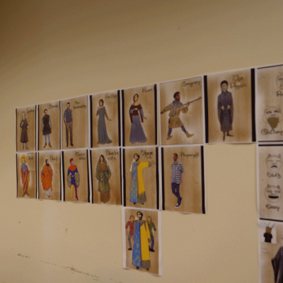 Costume designs and renderings on the wall 