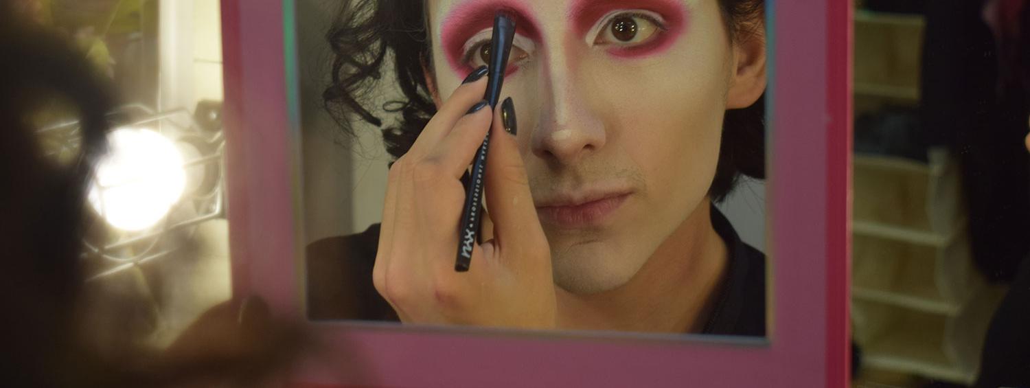 Mason Alexander Park Applying pink eyeshadow 