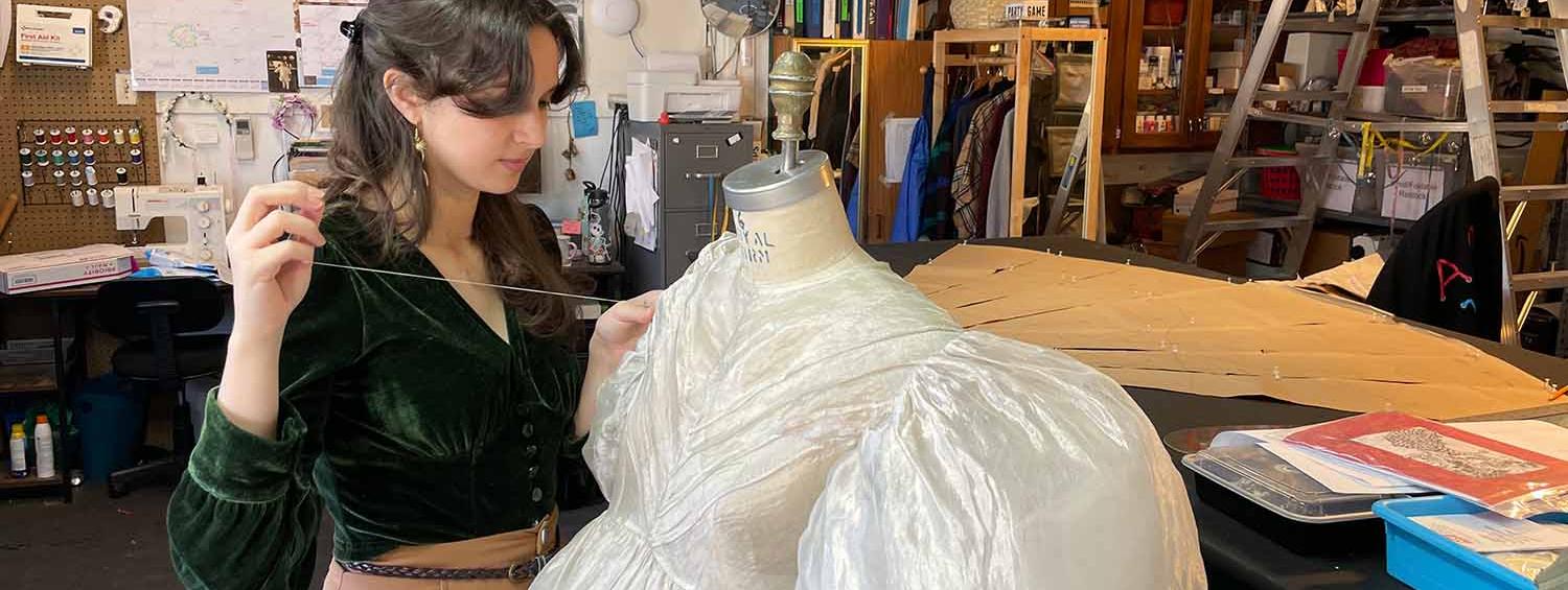 Julianna Fielding sewing a dress.