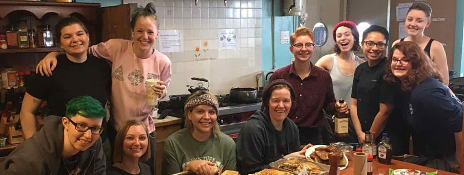 A photo of the apprentices with their homemade breakfast banquet 