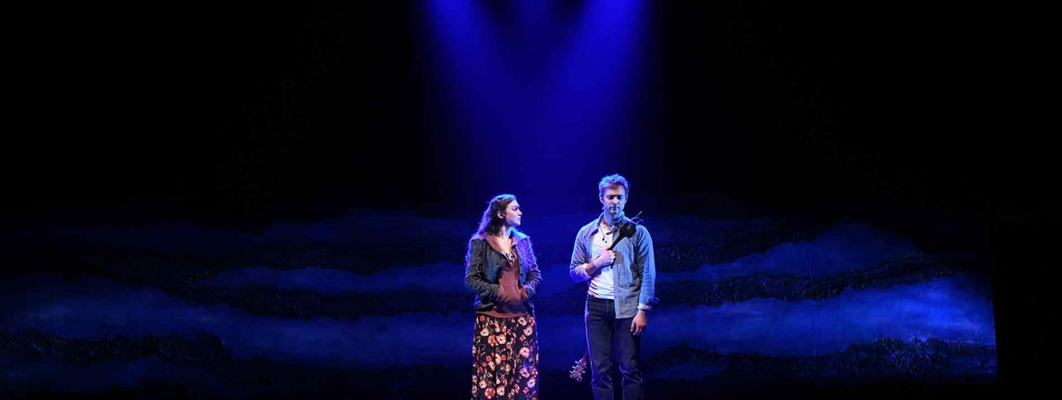 A photo of Guy and Girl on stage 