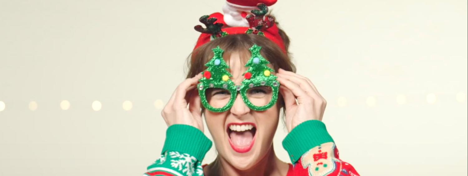 The Most Wonderful Time of the Year | Pictured: Patricia Hurley in a festive sweater, wearing christmas tree shaped glasses