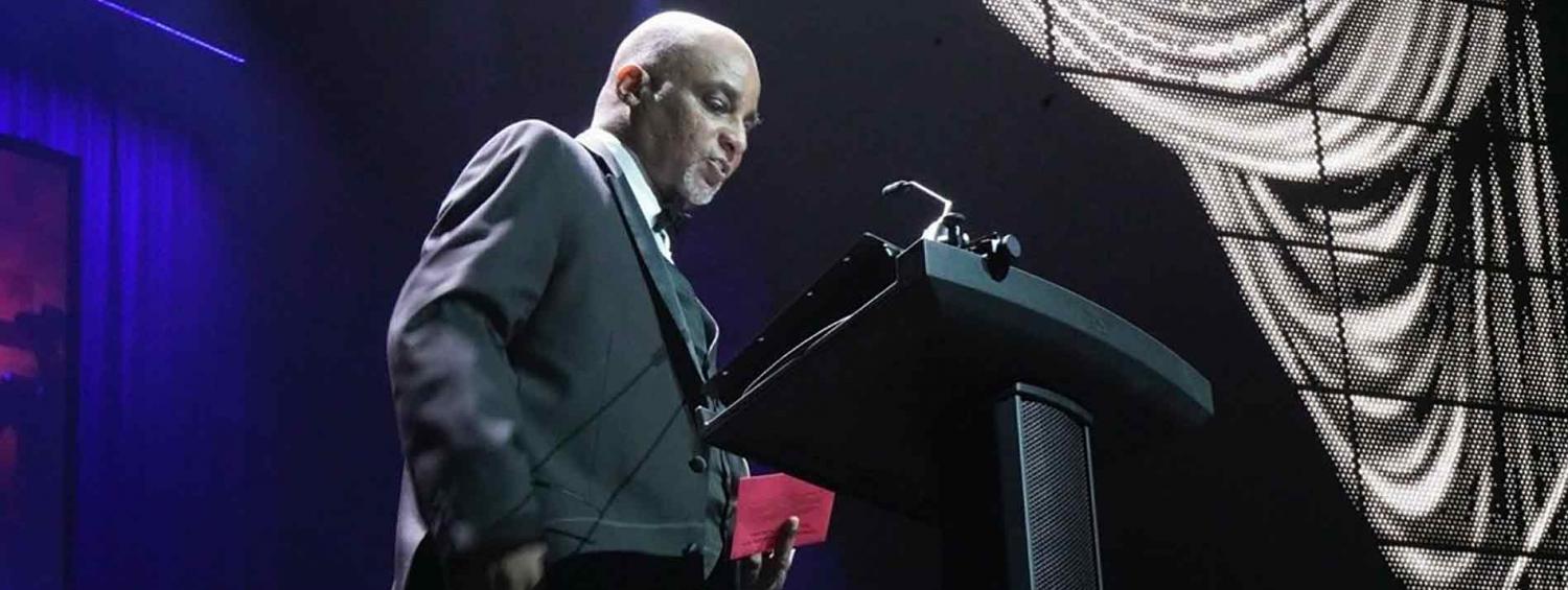 A photo of Weldon Brown presenting at the Helen Hayes Awards