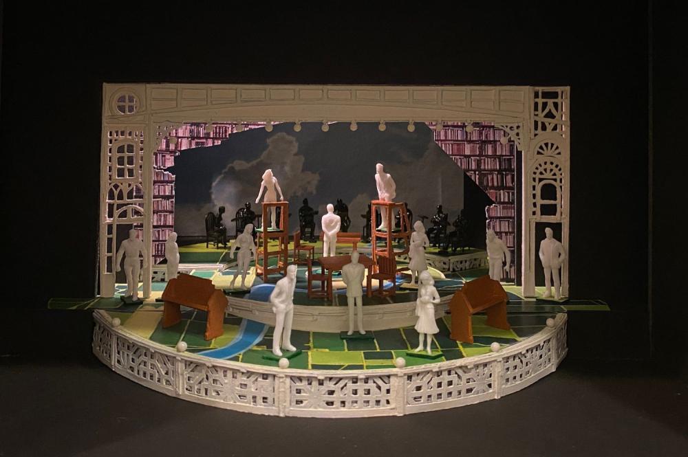 Image of The Music Man set model, two ladders, book carts, and benches