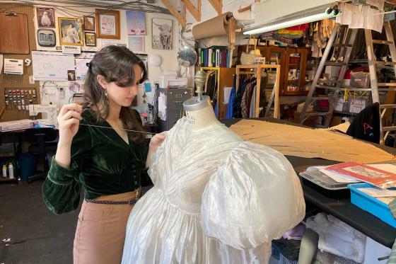 Julianna Fielding sewing a dress.