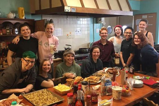 A photo of the apprentices with their homemade breakfast banquet 