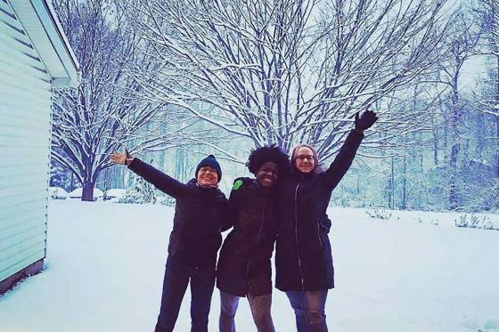A photo of the three new National Players, posing in the snow 